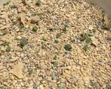 Close-up of the Roasted Garlic Sesame blend with sesame seeds, flakes and green scallion pieces